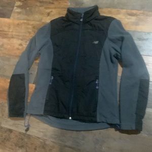 Women's size small new balance, jacket with pockets inside and out